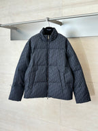 Long quilted Dior jacket with full-zip front, standing collar, dark textured fabric.