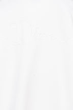 White sweatshirt front with subtle Dior signature embroidery near center
