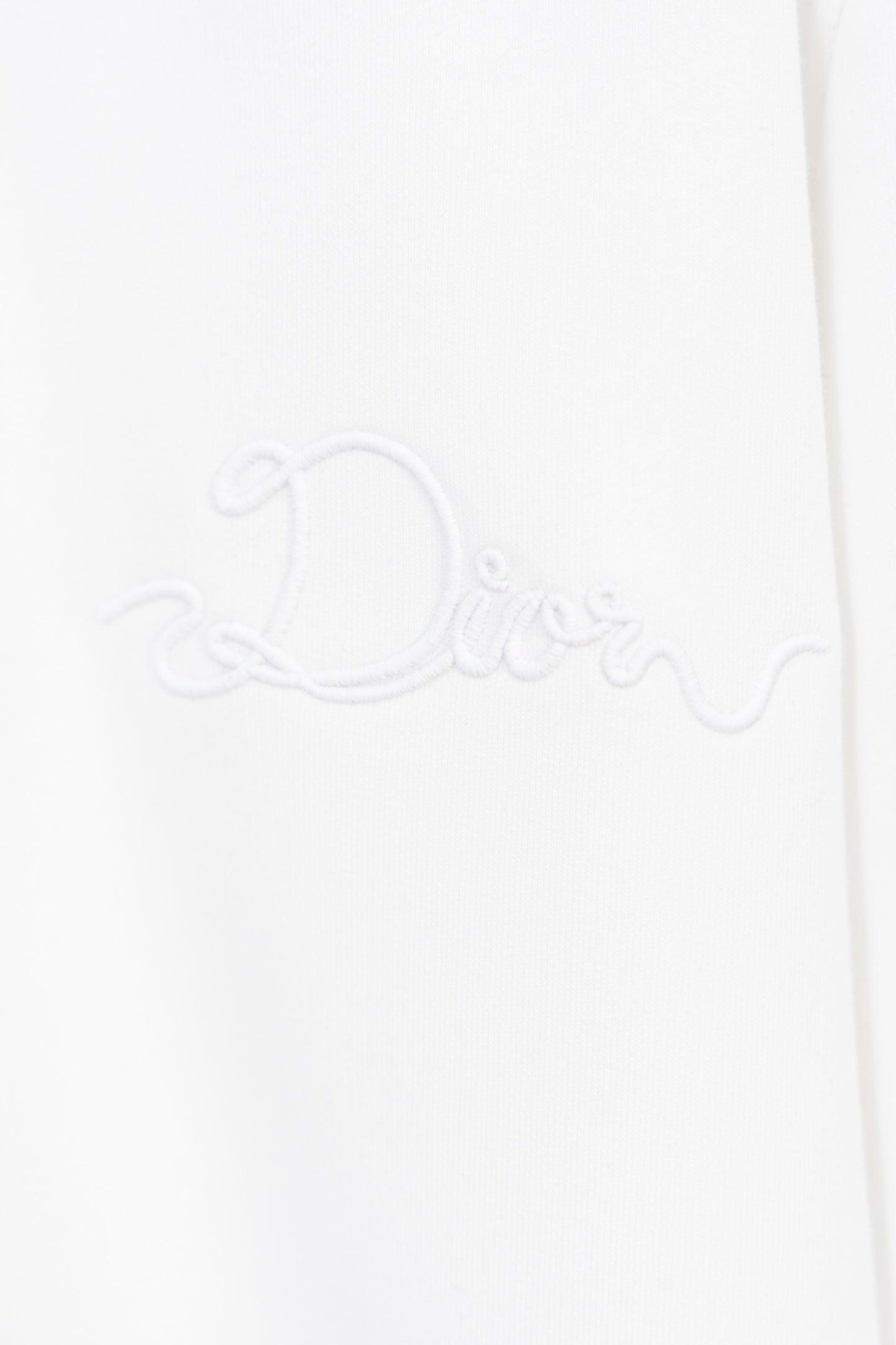 White sweatshirt with raised Dior signature-style embroidery on the front