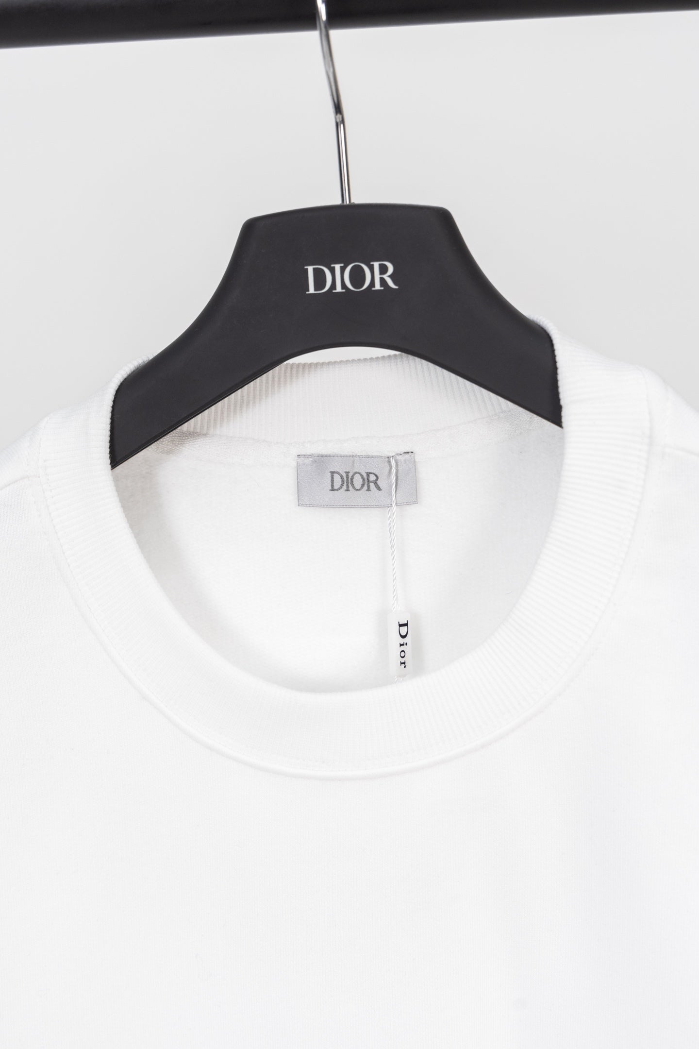 White sweatshirt crew neck with ribbed trim and Dior label on inner neckline
