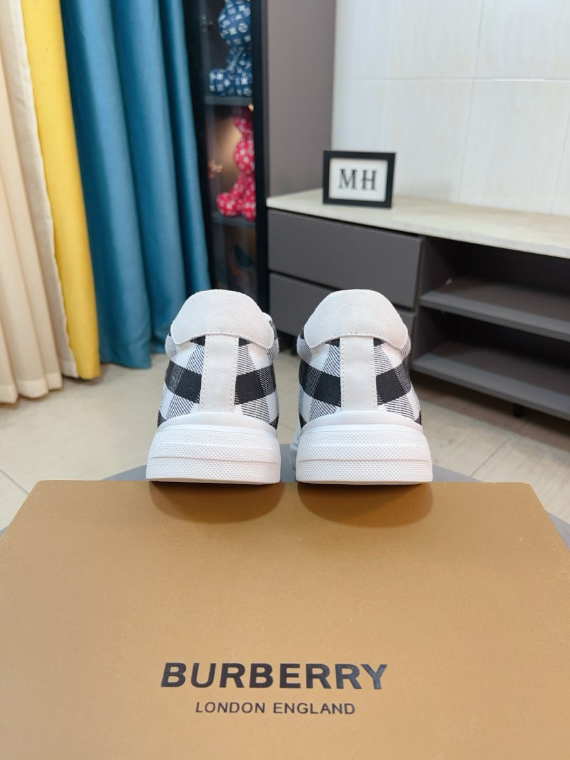 Pair of white sneakers with black-and-white check heel panels