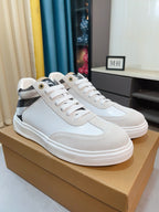 White lace-up sneakers with black-and-white plaid side detail