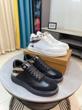Black lace-up sneakers with white sole and contrast side panels