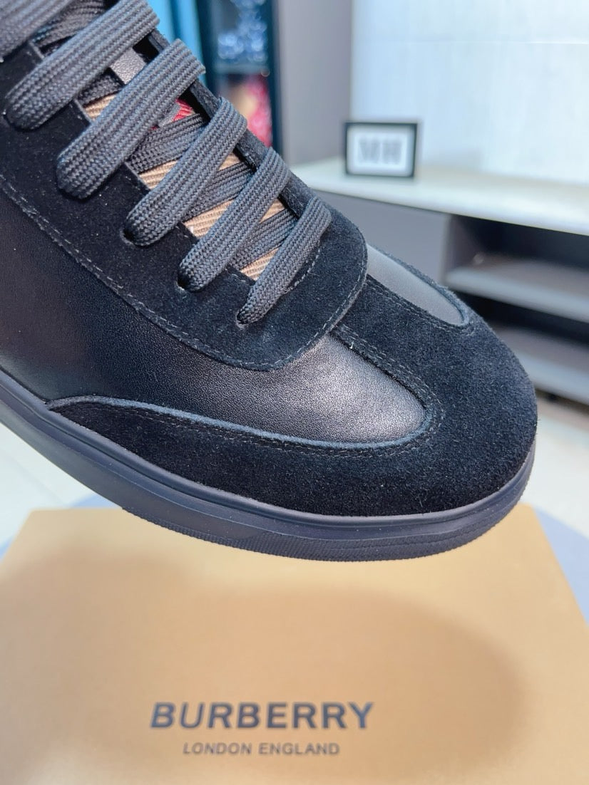 Burberry sneaker toe and laces in dark fabric with textured rubber bumper