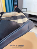 Burberry sneaker side with beige check strap detail and dark rubber sole