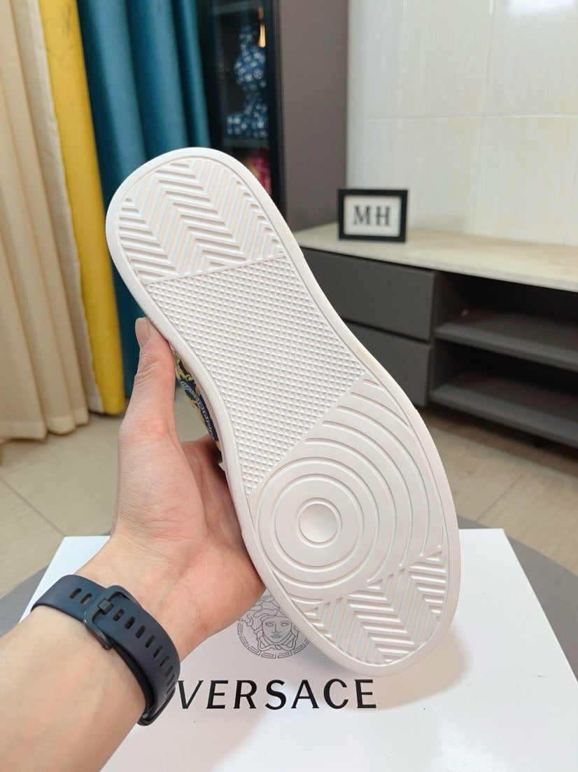 White rubber outsole with textured tread and circular logo detail