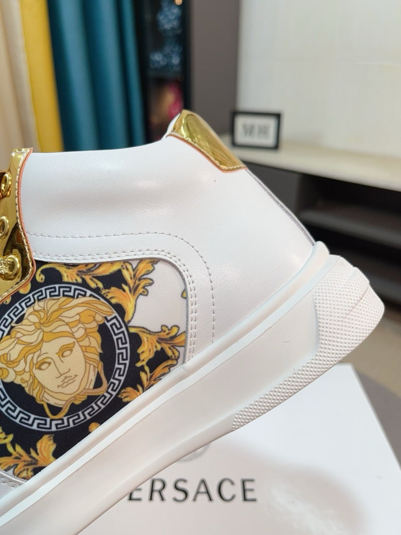 White mid-top sneaker with gold lace hardware and blue-gold Medusa emblem panel