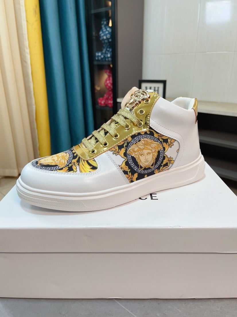 White mid-top sneakers with gold laces and blue-gold Medusa patch on side