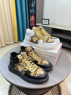 Mid-top sneakers with gold lace hardware and blue-gold Medusa medallion details