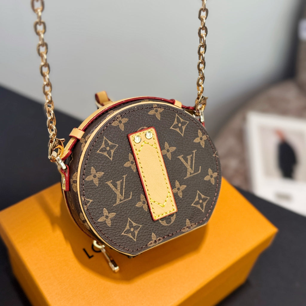 Round mini crossbody bag, brown monogram canvas with tan leather front and red trim