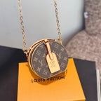 Round mini bag on gold chain, brown monogram canvas with tan leather front tab