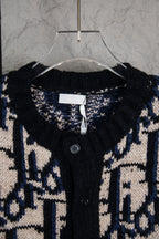 Dior knit cardigan neckline with logo pattern, black placket and visible button.