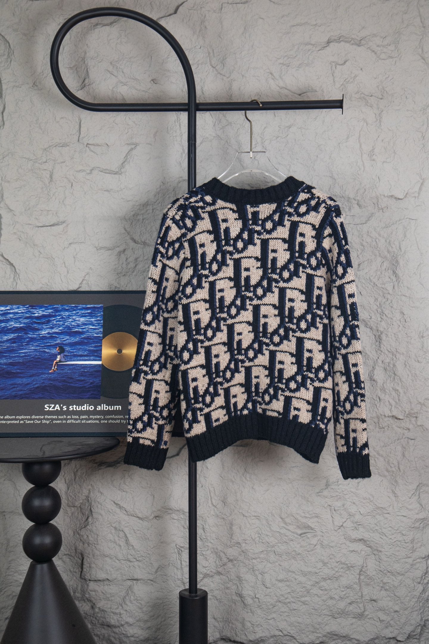 Dior knit cardigan in navy and cream with allover logo pattern and button front.