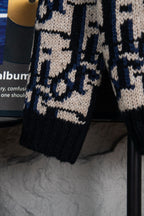 Dior knit cardigan sleeve and hem in navy and cream geometric logo pattern.