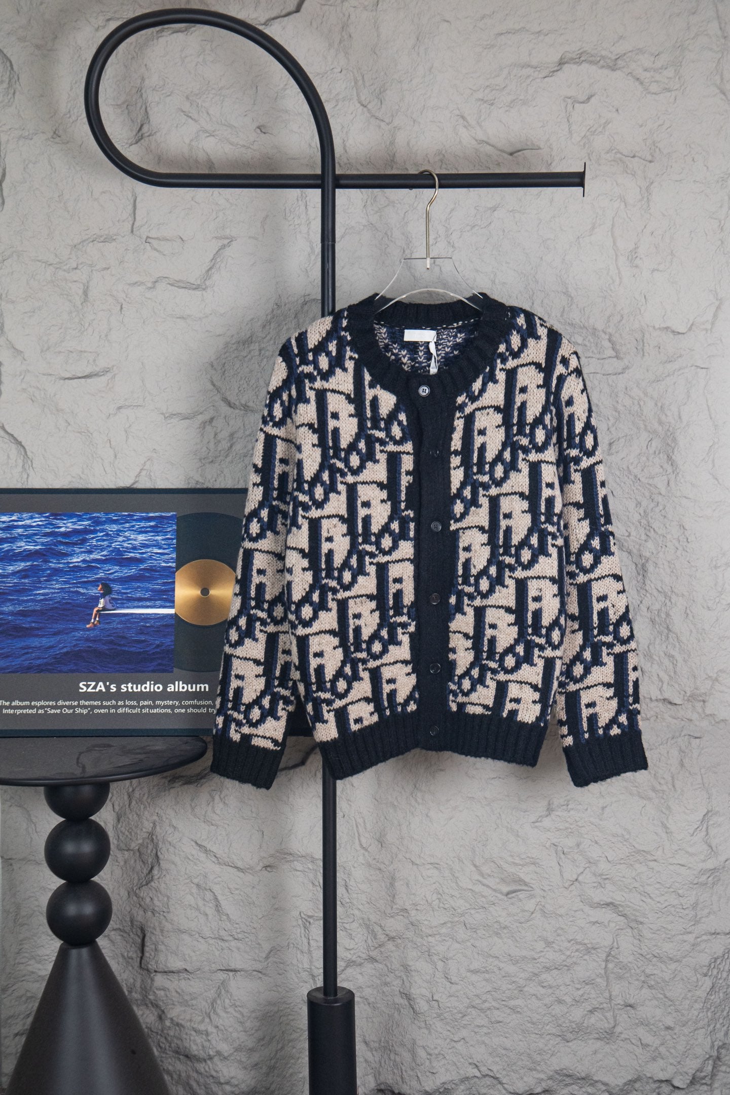 Dior knit cardigan with navy and cream logo-style pattern, button front.