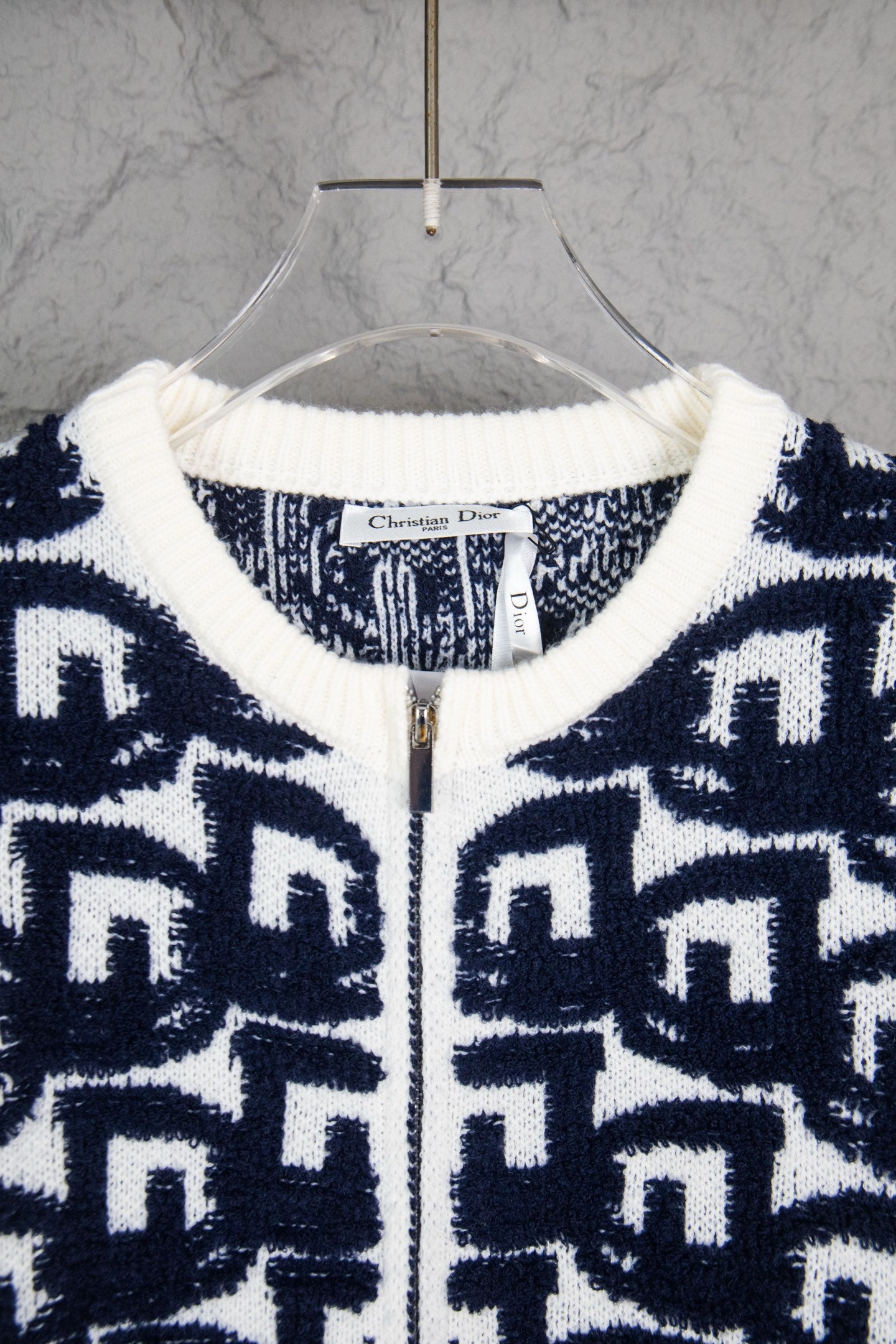 Navy-and-white knit sweater neckline with ribbed trim and zip front, Dior tag.
