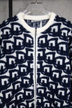 Navy-and-white knit sweater with ribbed collar and zip front, Dior logo pattern.