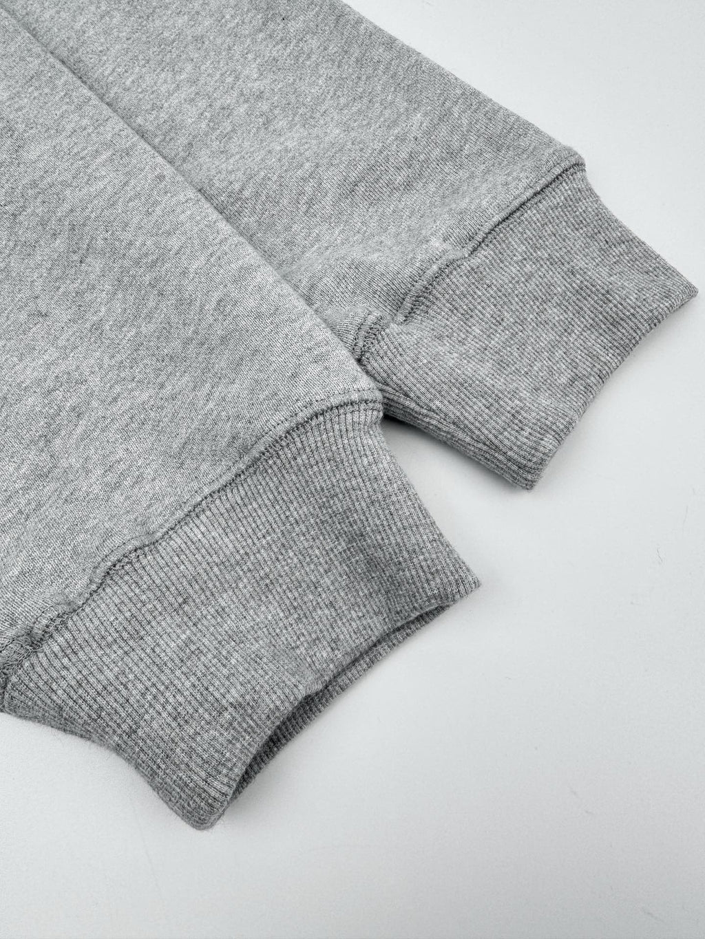 Heather gray sweatshirt sleeve cuffs with ribbed knit hem