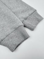 Heather gray sweatshirt sleeve cuffs with ribbed knit hem