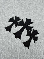 Black leaf-style graphic on heather gray sweatshirt front
