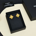 Gold-tone Chanel logo stud earrings in black gift box, amber enamel details