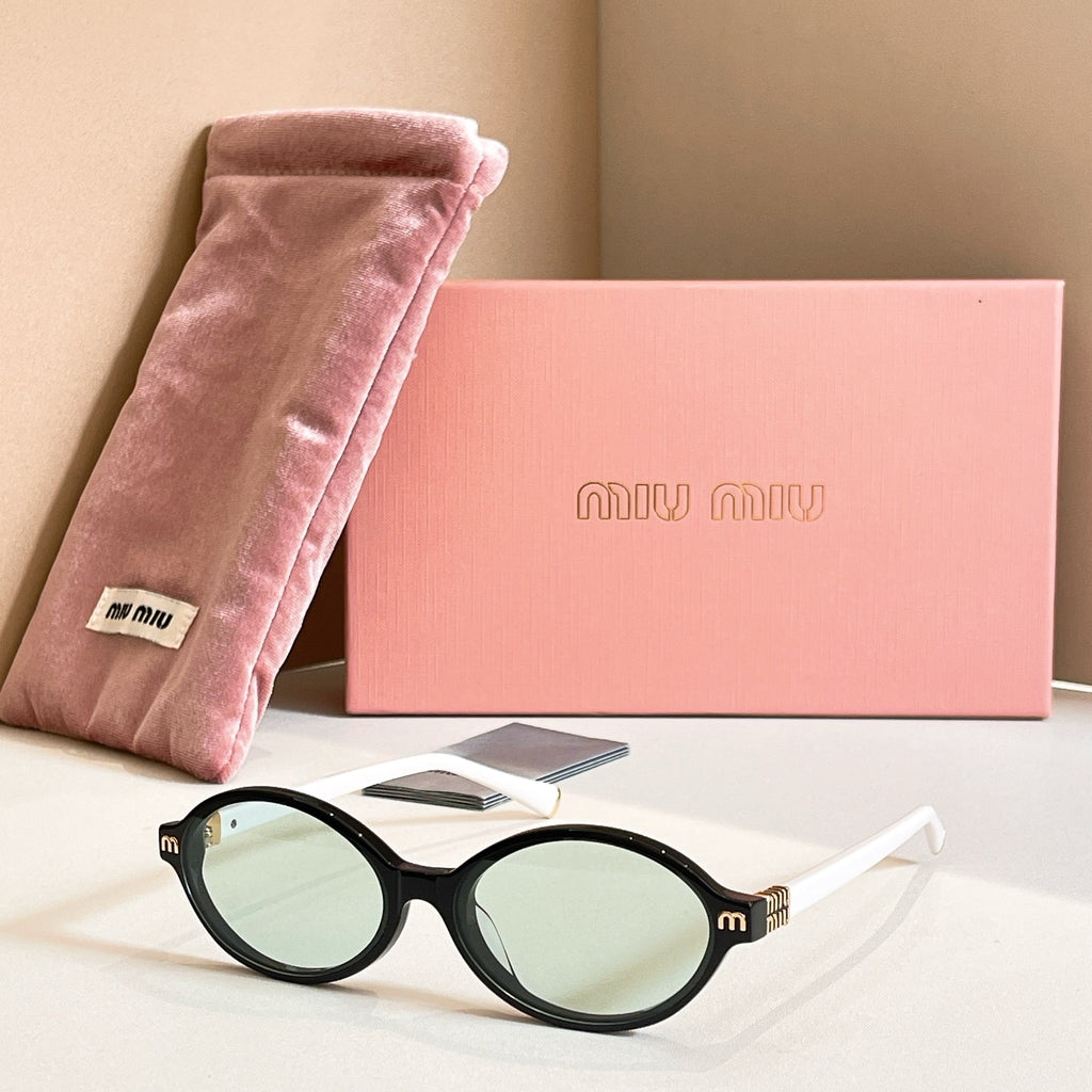 MiuMiu round sunglasses with black frame and light green tinted lenses