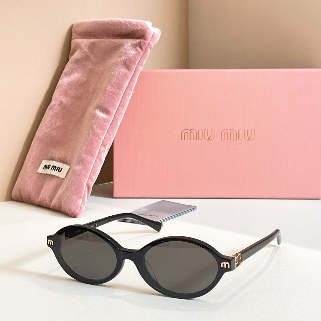 MiuMiu round sunglasses with black frame and dark tinted lenses