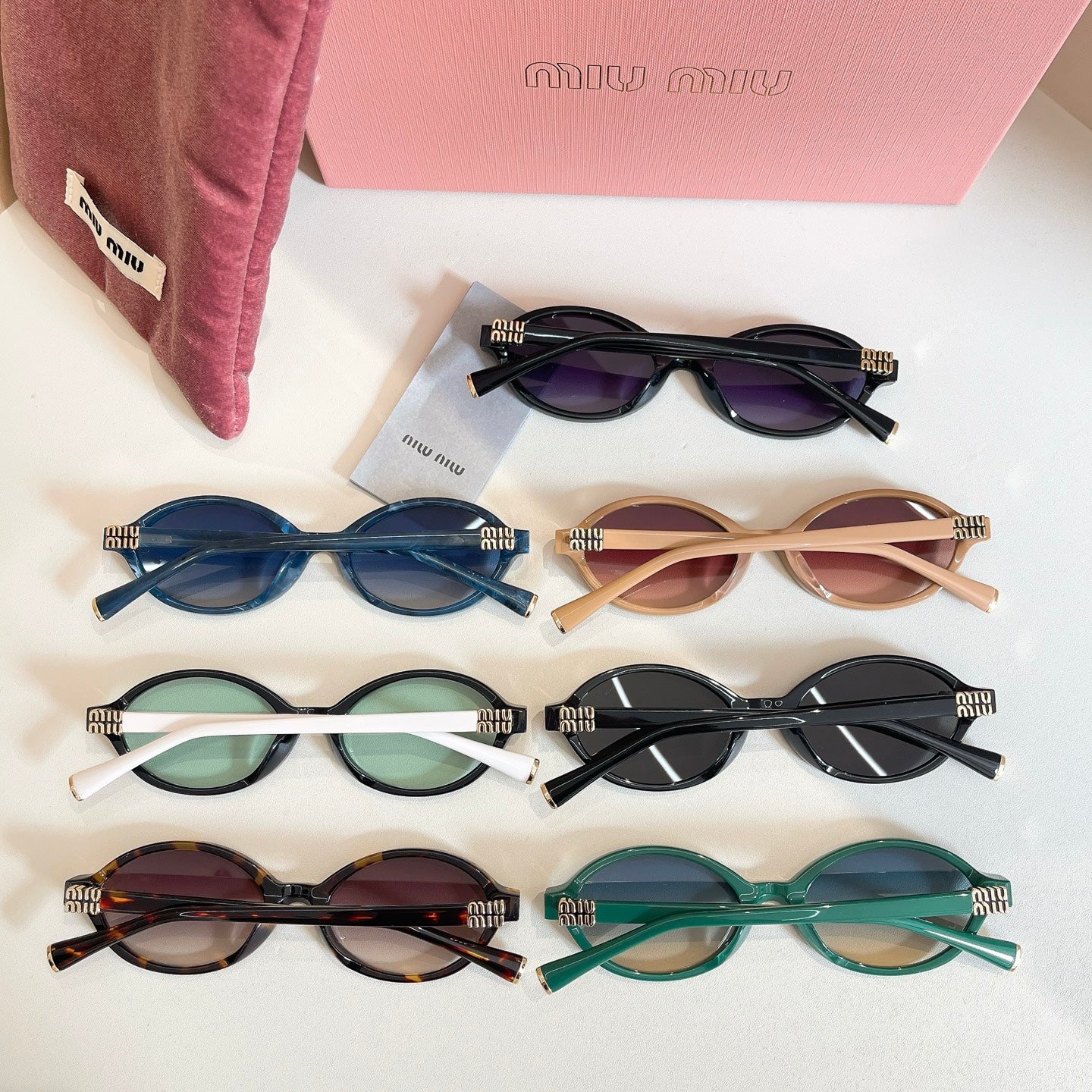 MiuMiu assorted round sunglasses set with different colored frames and tinted lenses