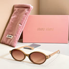 MiuMiu round sunglasses with tortoise frame and brown tinted lenses
