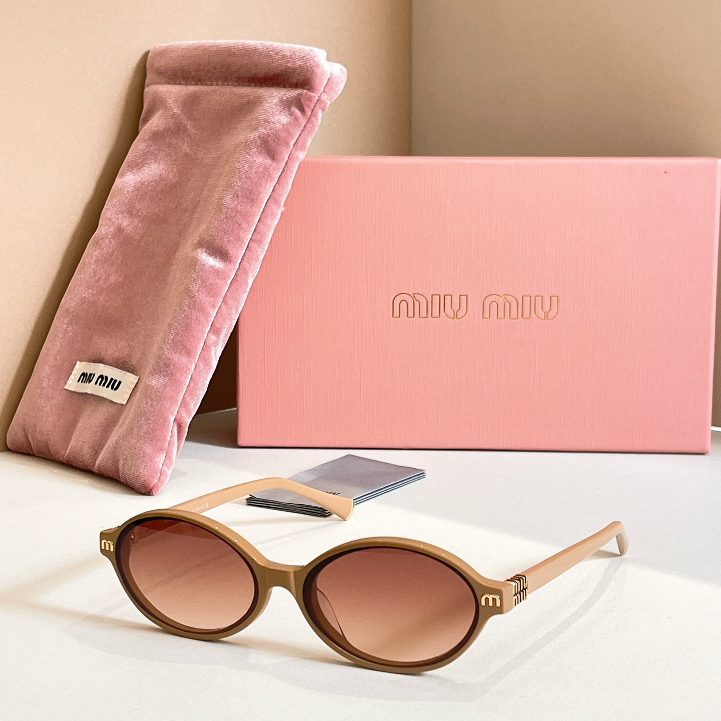MiuMiu round sunglasses with tortoise frame and brown tinted lenses