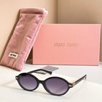MiuMiu round sunglasses with black frame and purple tinted lenses