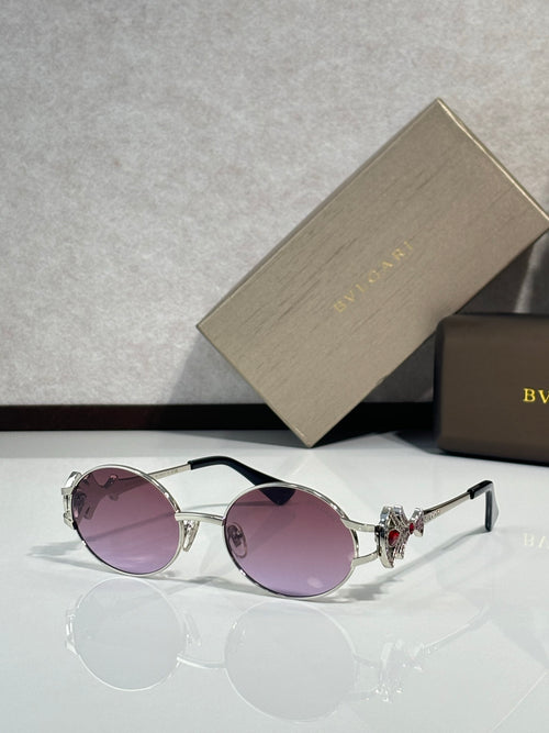 Round sunglasses with silver frame and purple tinted lenses