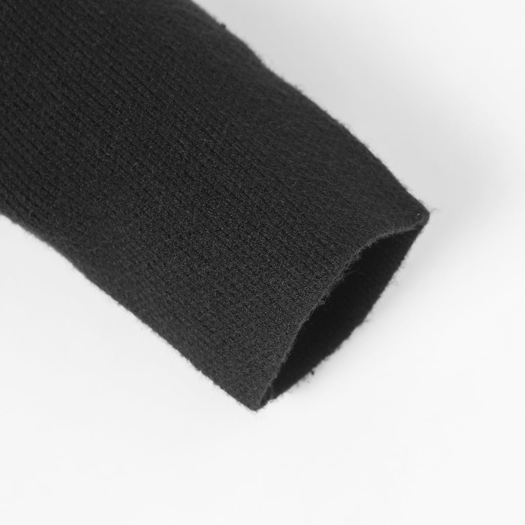 Dark knit long fabric with folded hem edge