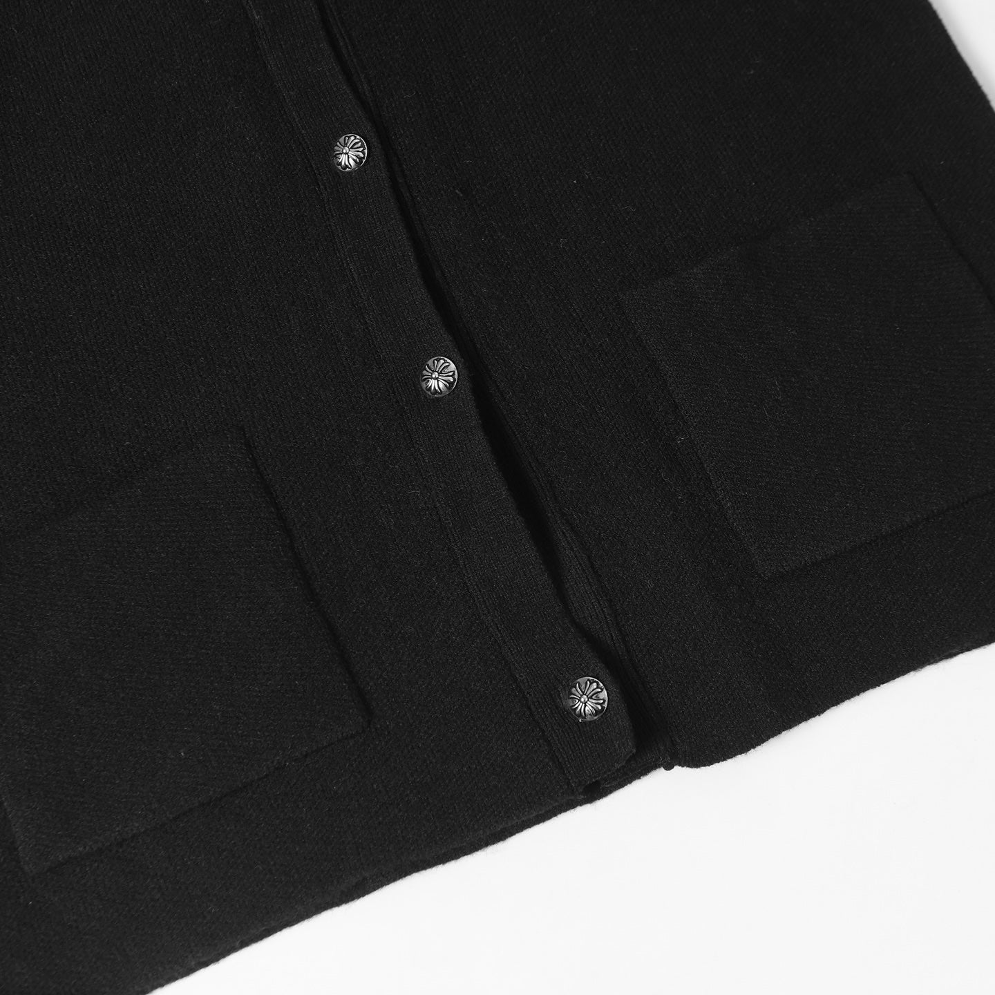 Black jacket button placket with small round buttons