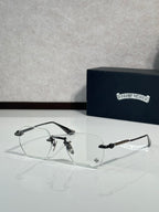 Chrome metal eyeglasses with clear lenses, curved bridge, and slim temples