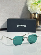 Chrome glasses with gold frame and teal tinted lenses, metal arms and hinge detail