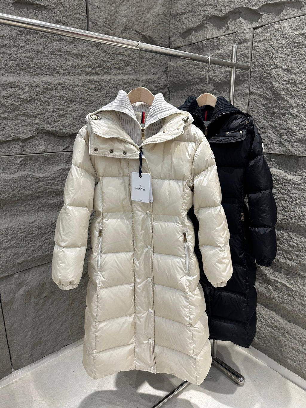 Cream Moncler long puffer coat with hood, front zipper, and quilted texture