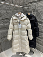 Cream Moncler long puffer coat with hood, front zipper, and quilted texture