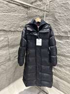 Dark Moncler long puffer coat with hood, front zipper, and quilted stitching