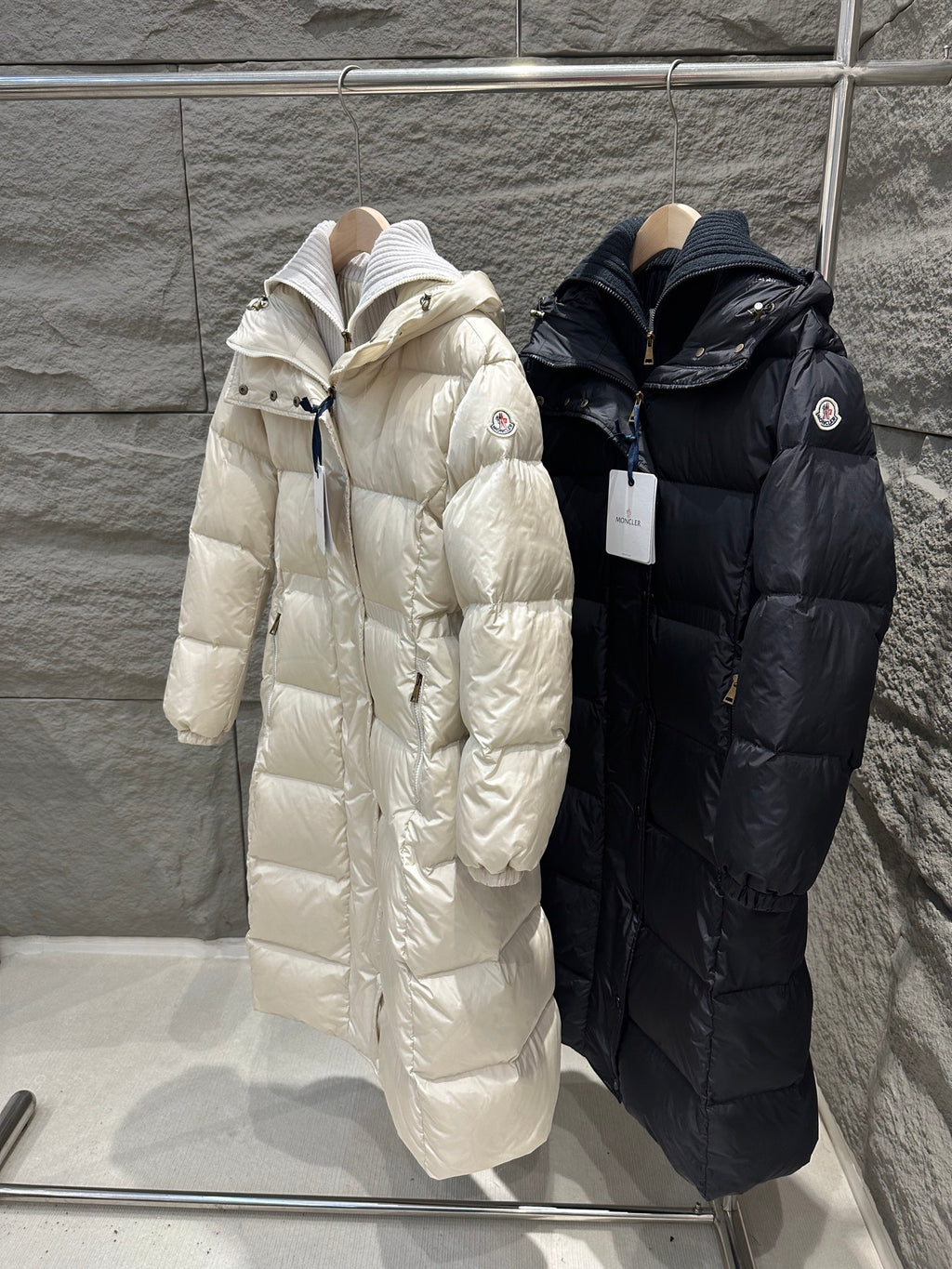 Cream and dark Moncler long puffer coats with hoods and quilted stitching