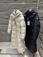 Cream and dark Moncler long puffer coats with hoods and quilted stitching
