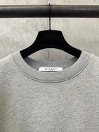 Givenchy grey crewneck sweatshirt neckline with brand tab