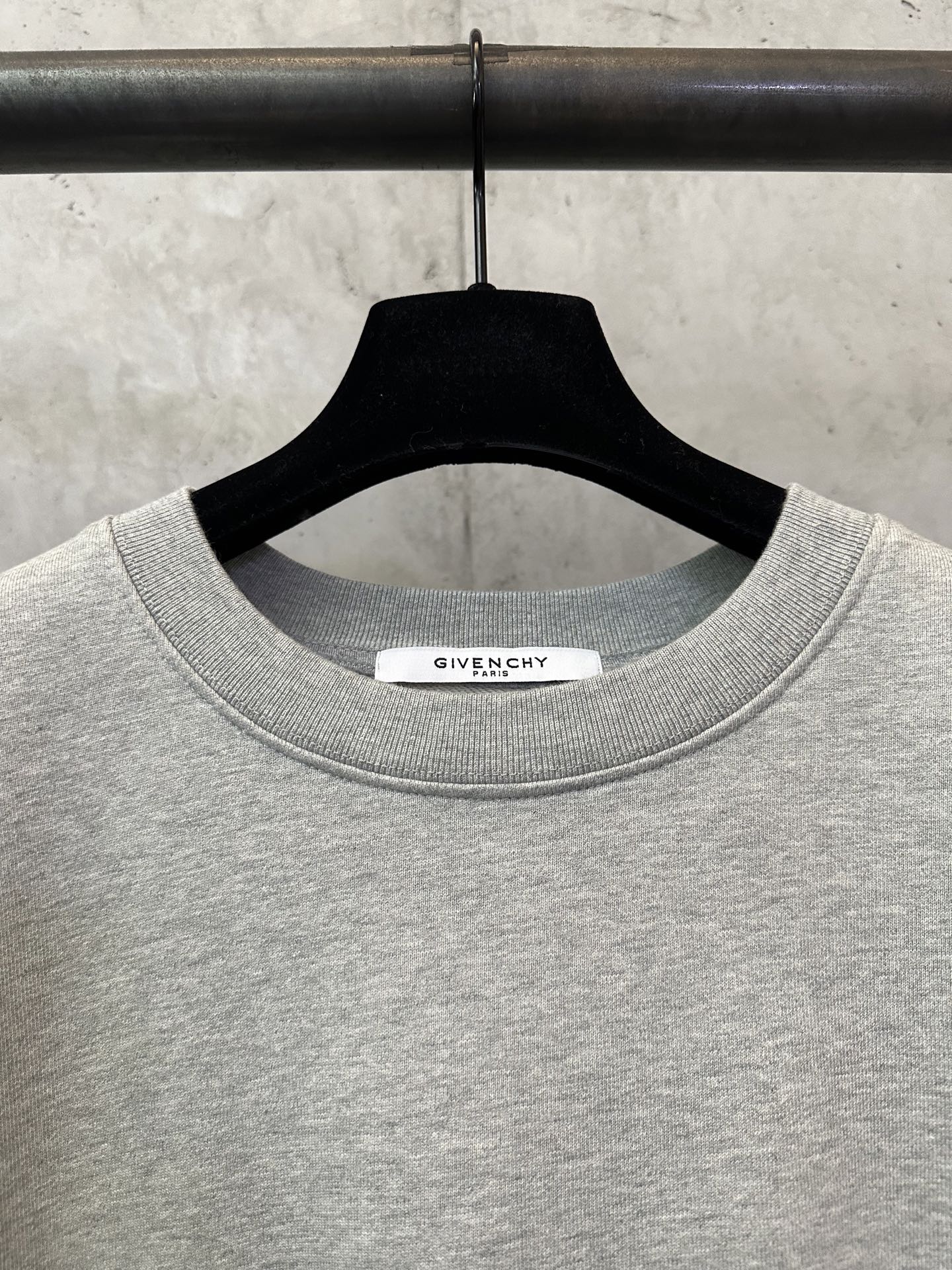 Givenchy grey crewneck sweatshirt neckline with brand tab