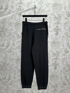 Louis Vuitton pants in dark color with elastic waist and small chest pocket detail