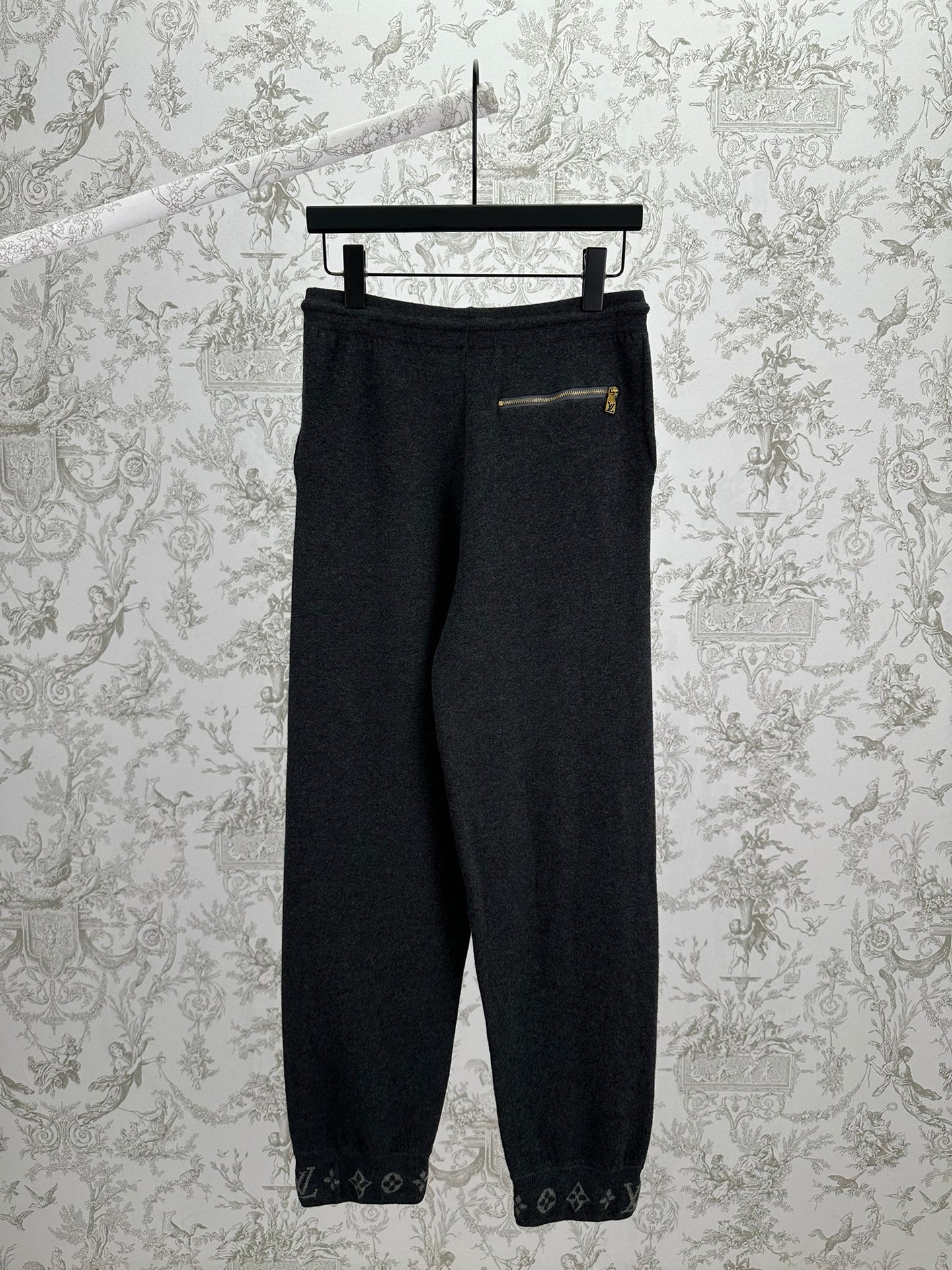 Louis Vuitton pants in dark color with elastic waist and small chest pocket detail
