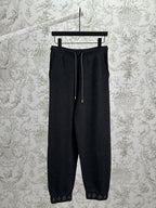 Louis Vuitton pants in dark color with drawstring waist and cuffed hem