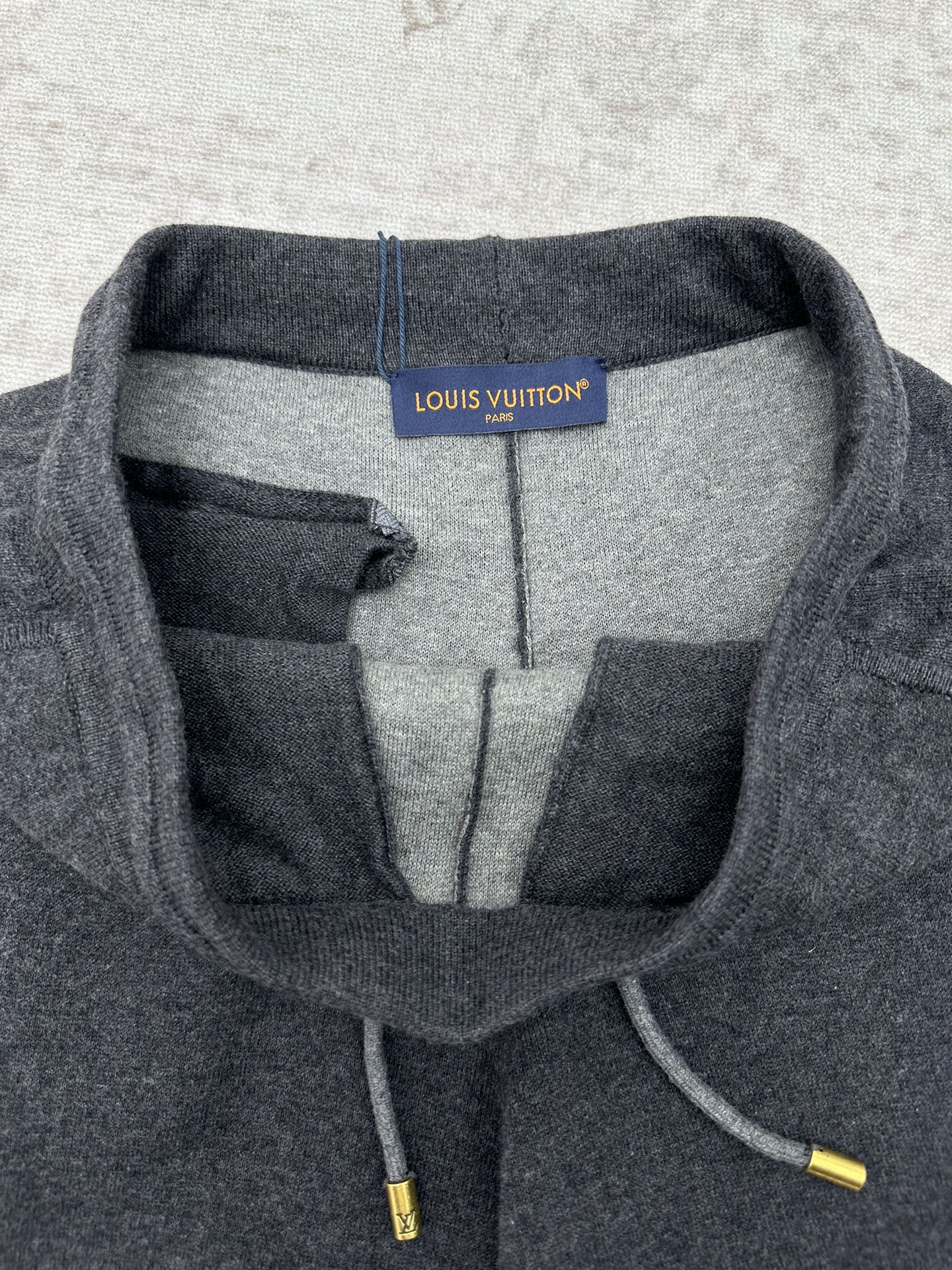 Louis Vuitton pants heather gray with drawstring, inner lining, and side pocket view