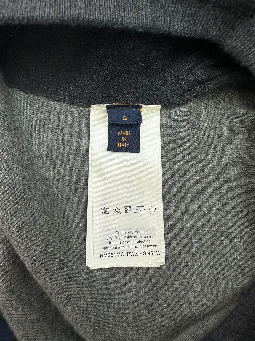 Louis Vuitton pants fabric with care label reading “Made in Italy”
