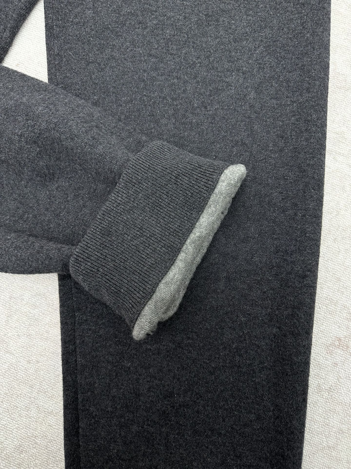 Louis Vuitton pants fabric detail at cuff with textured knit and dark color