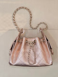 Chanel quilted top-handle handbag with chain strap, rose-pink leather, logo medallion